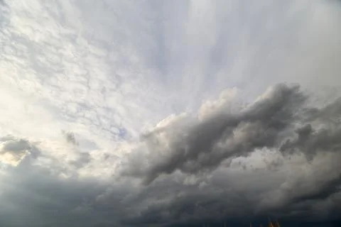 Low storm clouds rolling across sky, dense base and textured upper layers, .. Stock Photos
