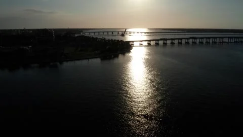 Low Sun Glare Over Manatee River Bridge and Waterfront Park From Drone 스톡 동영상 337221263