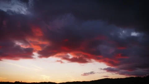 Low sun landscape dramatic clouds slow motion scene stock footage Vídeo Stock 314726875