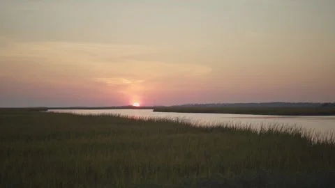 Low Sunset Over A Marsh Land 库存影片 205400216