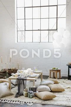 A low table laid for a meal Stock Photos