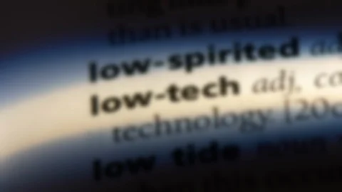 Low tech word in a dictionary. Stock Footage 99563011
