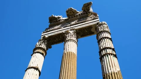 Low three ancient roman fluted columns ornate corinthian capitals weathered Stock Footage 324893811