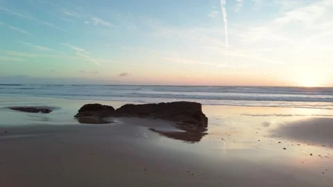 Low tide at the beach at sunset Stock Footage 274644675