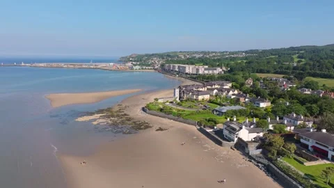 Low Tide Beachfront Homes and Curving Sand Spit near Irish Harbour Stock Footage 338077715