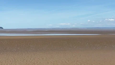 Low tide on a beautiful sandy beach view Stock Footage 149317688