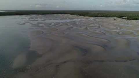 Low tide flight over the sand flats Stock Footage 148004364