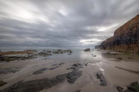 Low tide on a gray and cloudy day Stock Photos