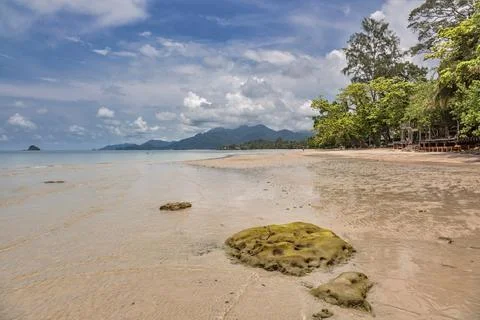 Low tide on Kai Bae Beach under a blue sky with clouds on Koh Chang Island Stock Photos