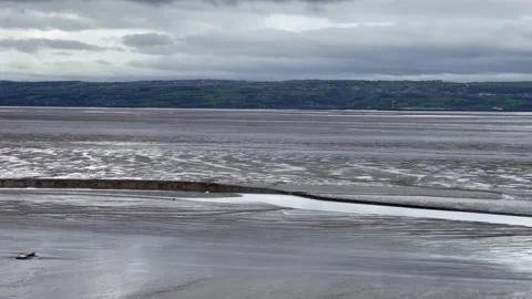 Low tide moody sky beach sea Stock Footage 244930069