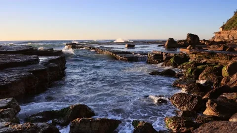 Low tide seascape of rolling waves on rocks of Sydney Northern beaches 4k. Stock Footage 158710537