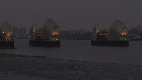 Low tide view of illuminated Thames Barrier flood gates, London, UK Stock-Footage 284163841