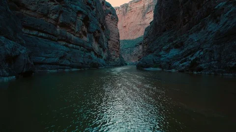 Low tracking over the Rio Grande river in the river canyon near Mexico and Stock Footage