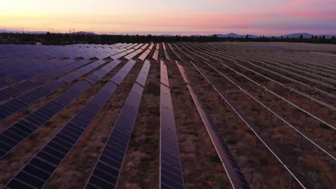 Low tracking shot over solar panels, with sunset colors, near Bend, OR Stock Footage 160931894