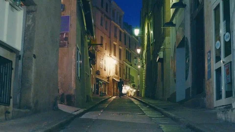 Low tracking shot of someone walking towards camera on street Stock Footage 88903466
