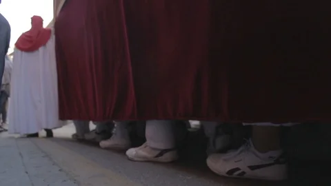 Low view of the feet of the float bearers carrying a holy week pass in Video stock 105734177