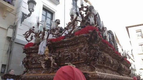 Low view of holy week pass being raised by the float bearers in the Video stock 105607888
