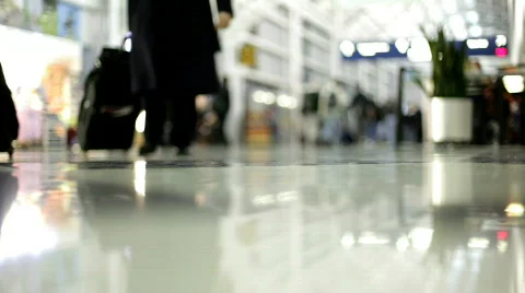 Low View of People walking through Airport terminal Video stock 636108