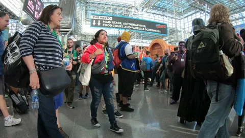 Low view of people walking through a convention hall Video stock 148517542