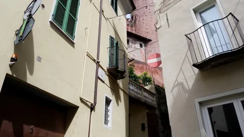 Low view. Tower that stands out on the surrounding houses. 库存影片 163670945