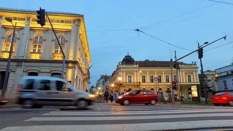 Low view of zebra crossing during traffic jam in Belgrade at dusk Stock Footage 91656328