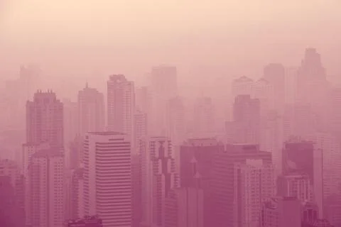 Low visibility caused by pollution problem in urban area during sunset, Ban.. Stock Photos