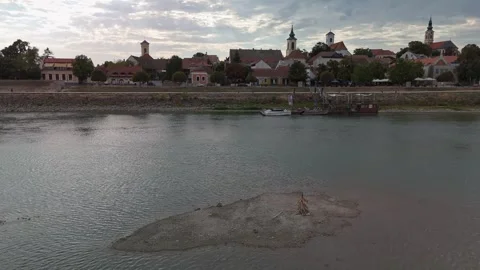 Low-water Danube island facing Szentendre's historic waterfront, Hungary Stock Footage 346704765
