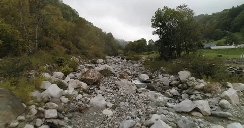 Low water flow in huge river bed with large rocks  drone aerial 4k Stock Footage 125757276