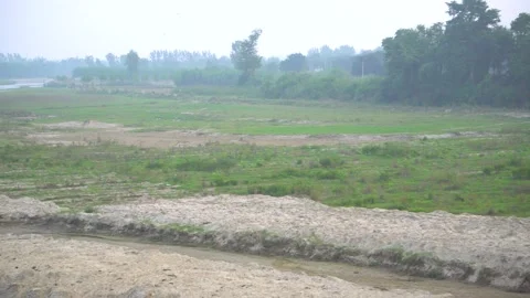 Low water river and its surrounding open ground landscape covered with large Stock Footage 217534016