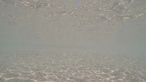 Low waves in coastal water Stock Footage 104749394