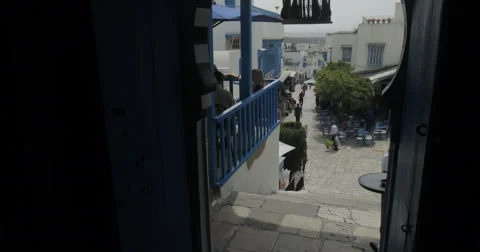 Low To a Wide Angle Of Sidi Bou Said From Inside The Cafe De Delice Stock Footage 61301673