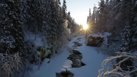 The low winter sun illuminates a river Stock Video Pond5