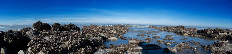 Lowangle view of breakwater Stock Photos