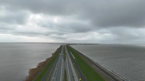 Lower aerial glide along the first stretch of the dam Stock-Footage 331828914