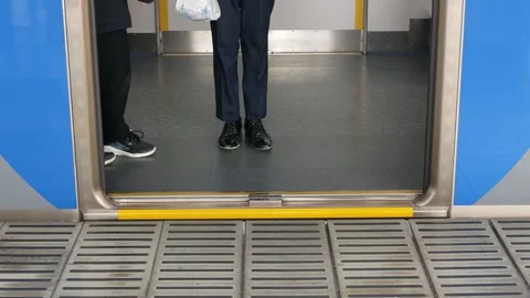 Lower angle view to door of train commuter subway while train door closing .. Stock Footage 285295830