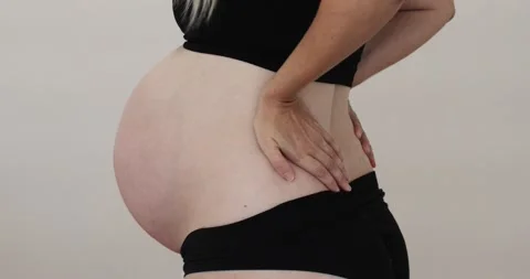 Lower back pain in pregnancy, third trimester Stock Footage 161289251