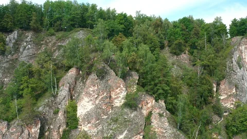 Lower the copter down the cliff. 스톡 동영상 115858619