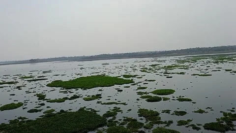 A lower dam is depicted, featuring a steady flow of water Stock Footage 280139027