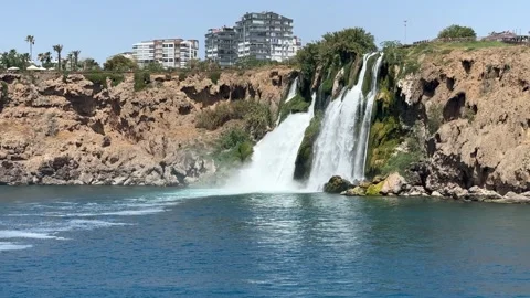 Lower Duden Falls cascade dramatically from a rocky cliff Stock Footage 297961497