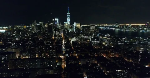 Lower Manhattan skyline and river shorelines after dark 76968988