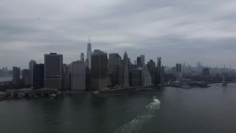 Lower Manhattan Skyline from the bay, cloudy, 14/11/2024, HD Stock Footage 307339662