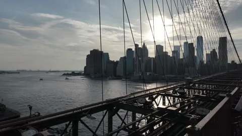 Lower Manhattan Skyline from the Brooklyn Bridge at Sunset Stock Footage 340856932