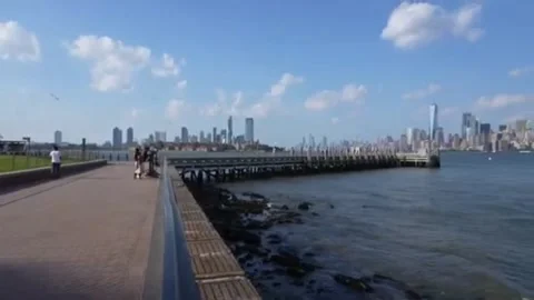 Lower Manhattan Skyline View From Waterfront Pier Walkway 스톡 동영상 344009305