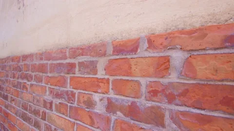 Lower part of house wall cladding with brick in Burano Video stock 163464412