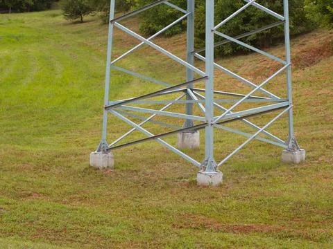 Lower part of a large electric support on a nature background Foto stock