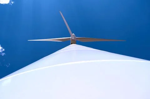 Lower plane of the tower of a windmill with its blades Stock Photos