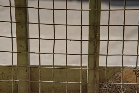 Lower portion of iron gate sealed with net Stock Photos