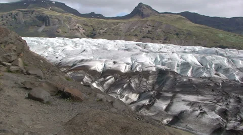 Lower section of a glacier with dirty ice in foreground Stock Footage 37892678
