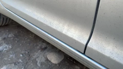 Lower section of a silver car door opens and closes above the rocker panel, Stock Footage 337113995
