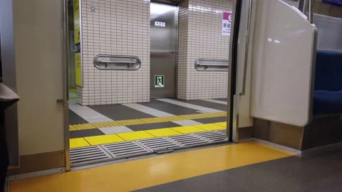 Lower view to train door inside subway train commuter while door is closing Stock Footage 221882654